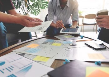 Business,People,Writing,On,Sticky,Notes,For,Colleagues,Thinking,Strategy